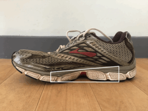 Running shoe with raised heel showing high heel drop